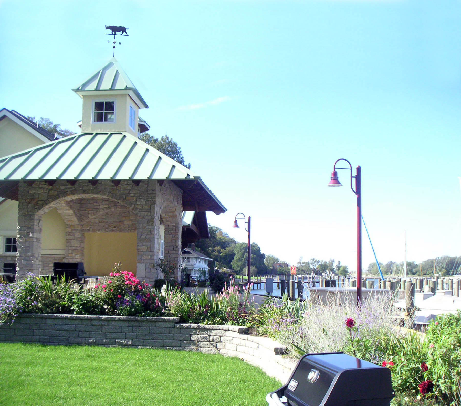 Covered grilling shelter and lawn at the marina