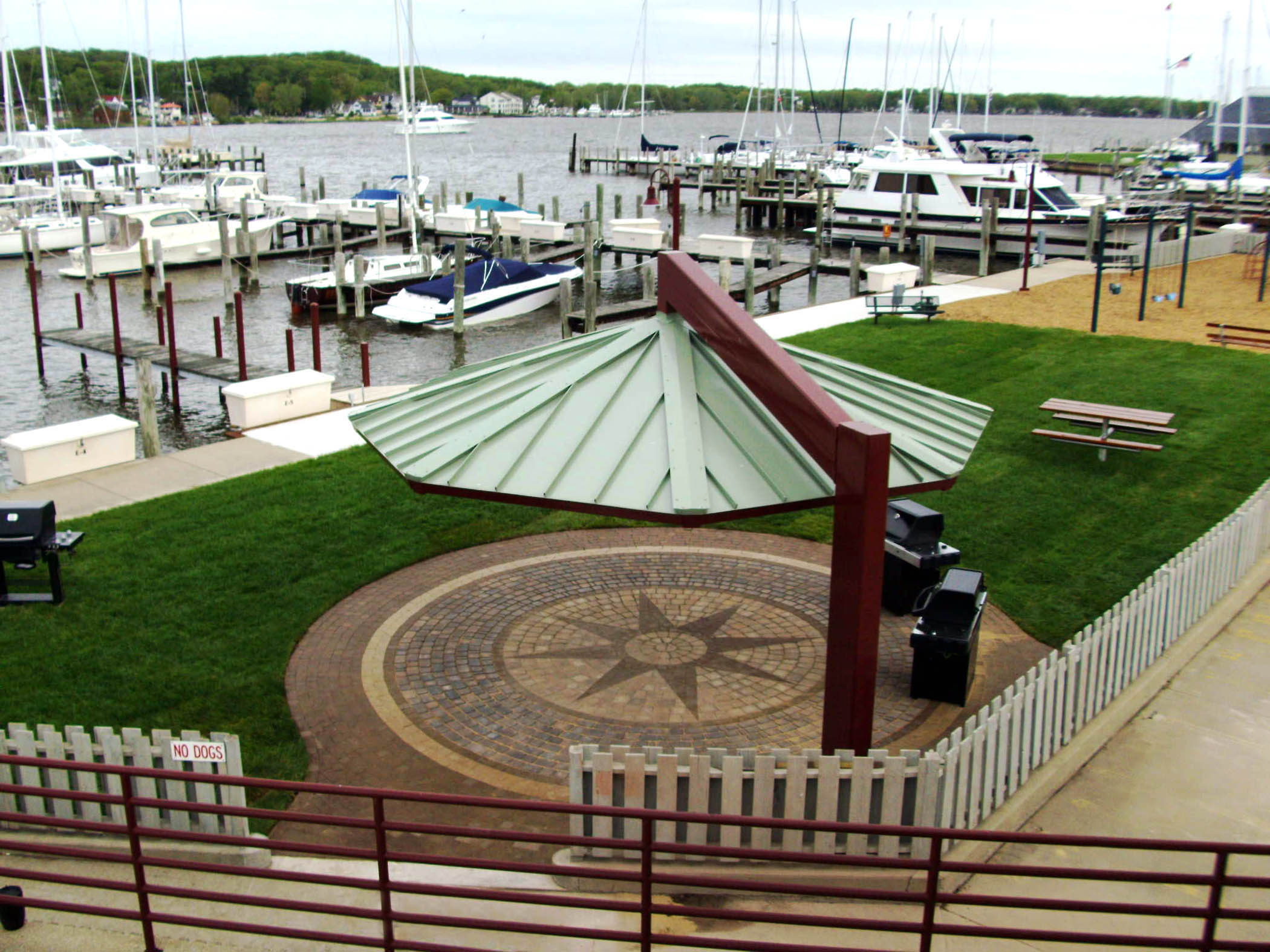 Covered picnic area and lawn at the marina