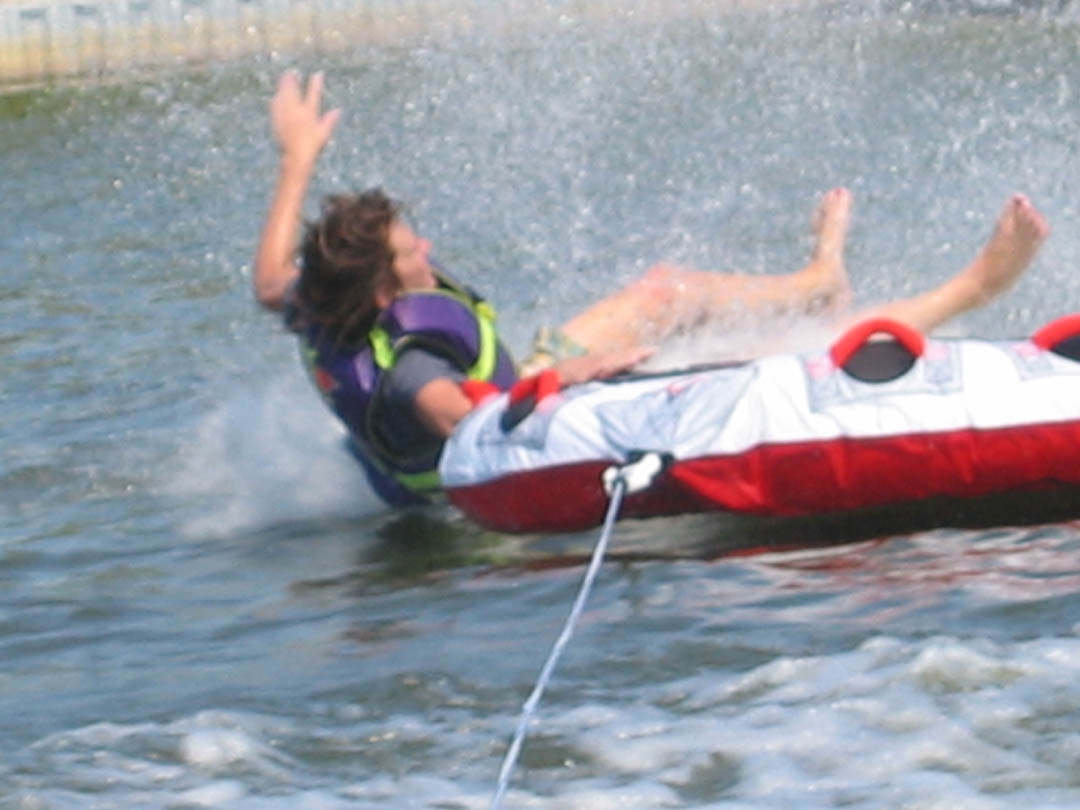 A rider on a towable tube on Lake Macatawa
