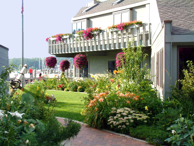 Flower gardens and clubhouse at the marina