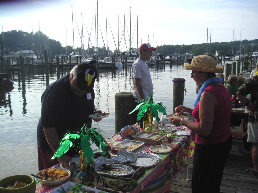 Boaters sharing a potluck on the docks at Eldean Shipyard