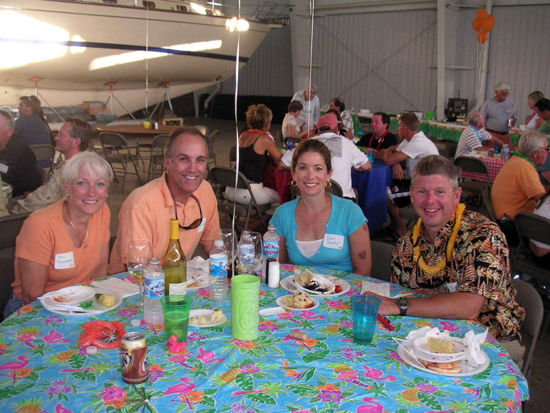Waterfront event space set for a reception overlooking Lake Macatawa at dusk