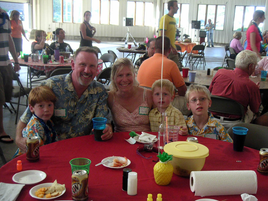 The Eldean family gathered around a table at the marina